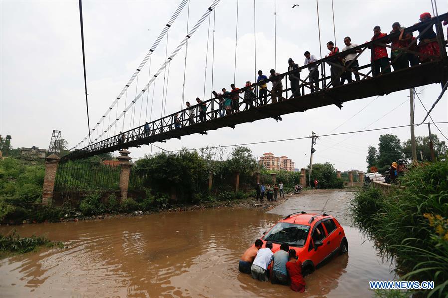 NEPAL-KATHMANDU-RAIN-STUCK CAR