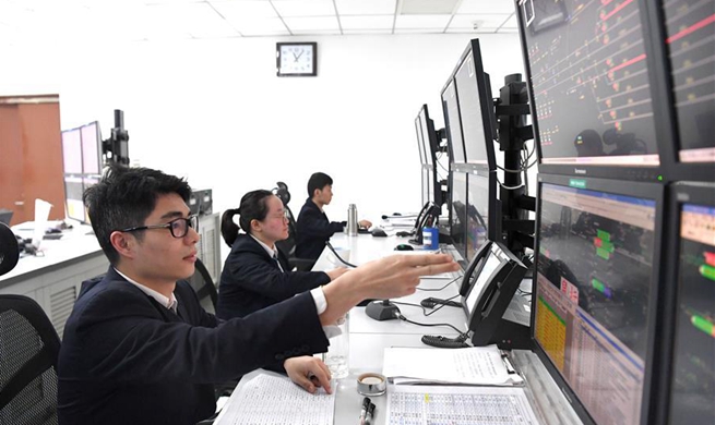 Staff members at Nanning East Railway Station busy working during Spring Festival travel rush