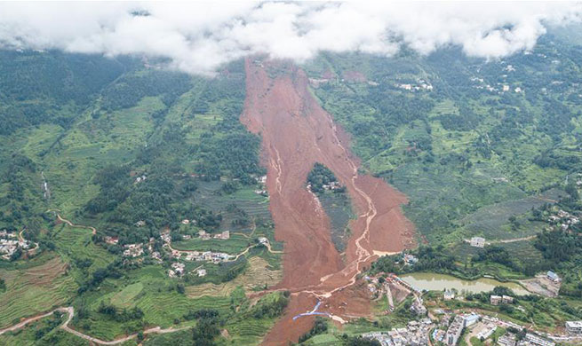 Death toll rises to 13 in SW China landslide