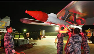 J-11 air fleet conducts night mission at Snowy Plateau